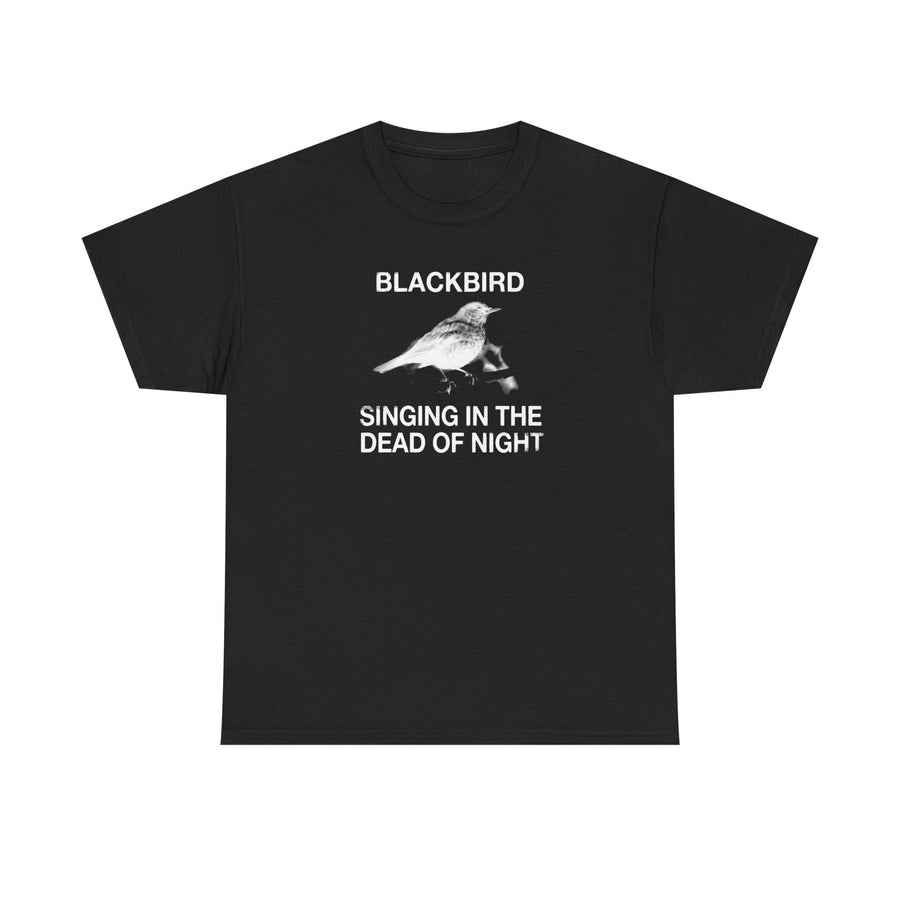 Black t-shirt printed with a photo of a small bird and the text Blackbird Singing in the Dead of Night.