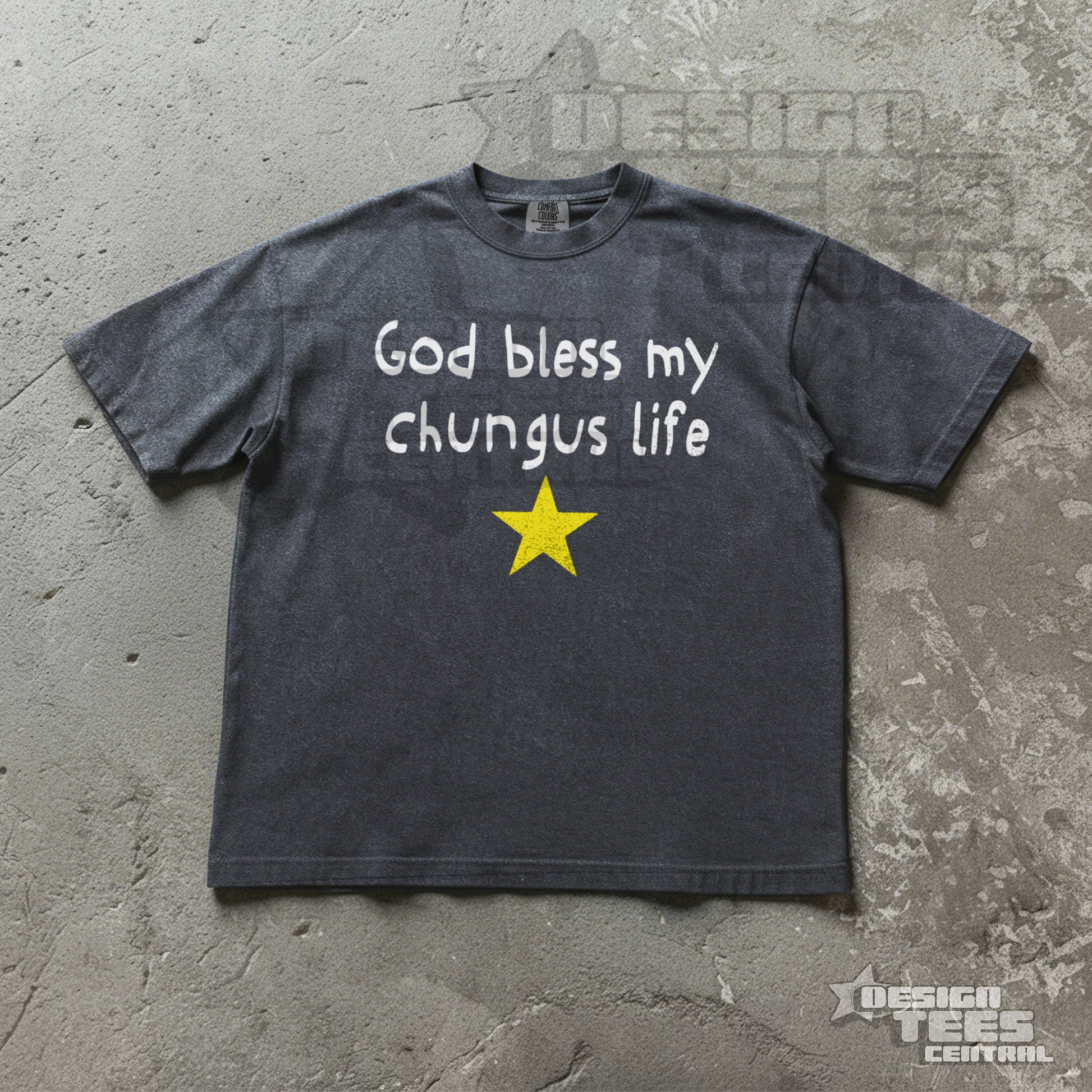 Gray t-shirt with 'God bless my chungus life' text and yellow star on a concrete surface.