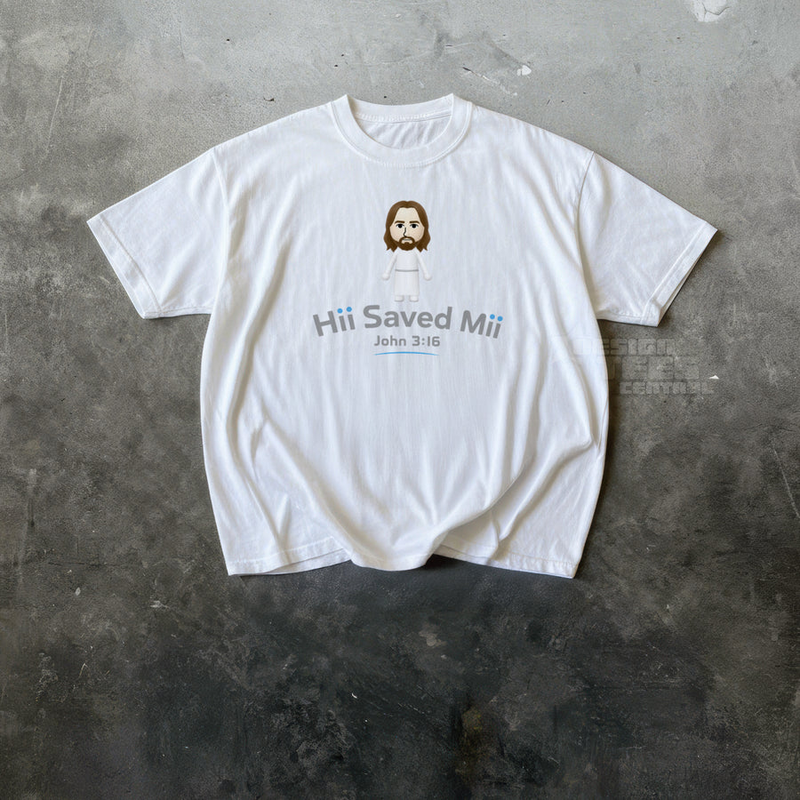 White t-shirt printed with a small blocky cartoon figure in a white robe above the text Hii Saved Mii and John 3:16.